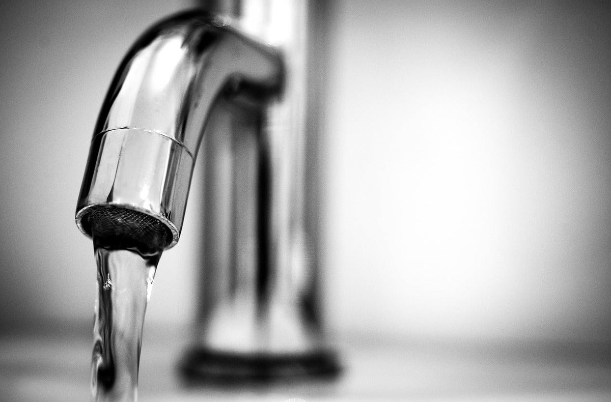 Tap with water coming out of the spout