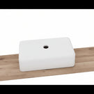 White ceramic rectangular undermount sink.