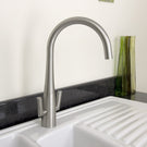 Silver single-handle high-arc kitchen faucet.