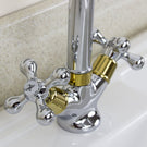 Classic dual-handle bathroom faucet with curved spout.