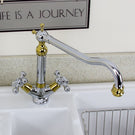 Gold-toned kitchen sink drain and strainer basket.