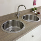 Stainless steel double bowl sink with two taps