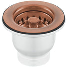 Copper-toned sink drain and strainer basket.