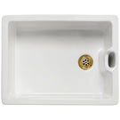 A white kitchen sink with a gold drain