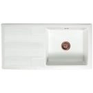 White double-basin sink with a bronze-toned drain.
