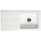 White ceramic sink with brass drain fitting