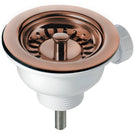 Copper-toned sink drain and strainer basket.
