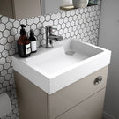 Small ceramic wash basin with single lever tap
