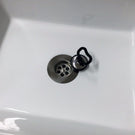 Chrome sink strainer with stopper mechanism