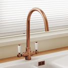 Modern rose gold kitchen mixer tap with dual lever handles