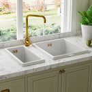 Double farmhouse sink with gold faucet setup