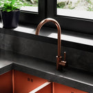 Copper-toned single-handle kitchen faucet.