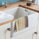 Undermount farmhouse sink with chrome faucet