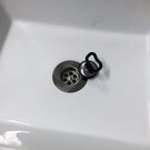 Chrome sink strainer with removable stopper