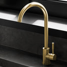 Gold-toned modern single-handle kitchen faucet.