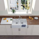 White double kitchen sink below wide window.