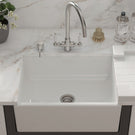 White ceramic sink with chrome faucet set