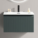 Green vanity unit with white basin and tap