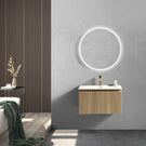 Grey vanity with white basin and round mirror