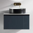 Drawer-open view of black vanity with square basin