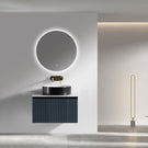 Black ribbed vanity with white basin and gold tap