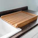 Wooden cutting board on a kitchen counter