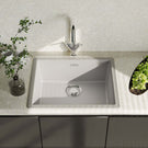 Modern kitchen sink with faucet on a light countertop