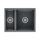 Black kitchen sink with double basin on a white background