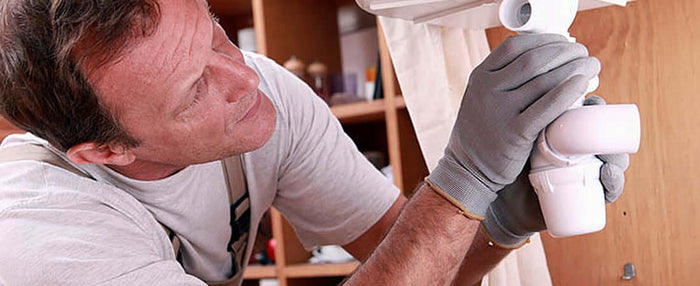 plumber assessing pipework