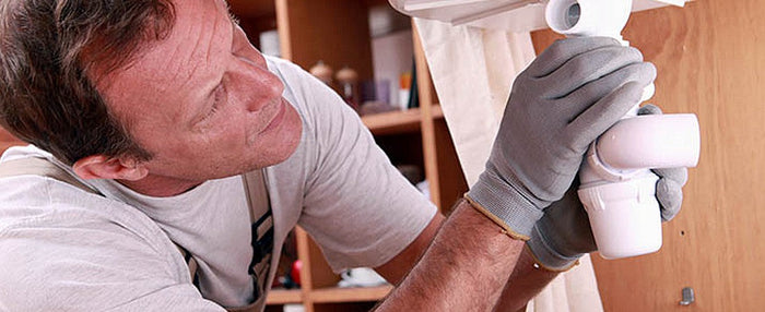 plumber assessing pipework