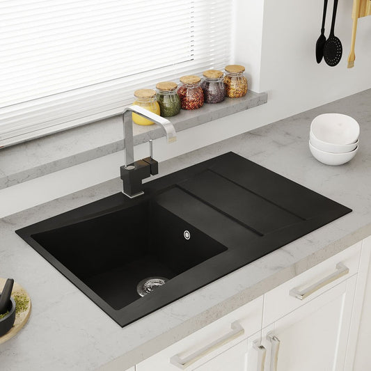 Modern kitchen with black sink and faucet