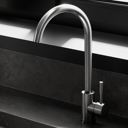 Silver kitchen faucet with a flexible sprayer.