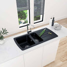 Modern black freestanding bath with chrome tap