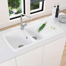 Modern double bowl sink with chrome mixer tap