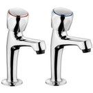 Pair of chrome dual handle pillar taps for basin