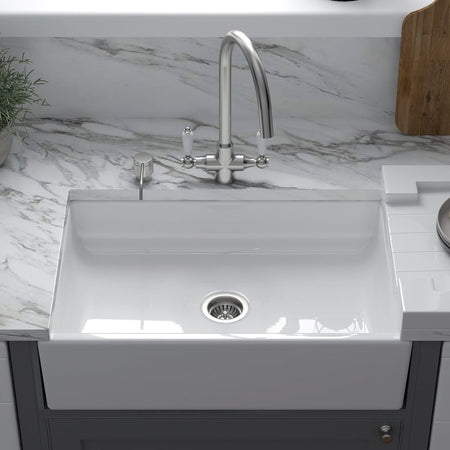 Large white ceramic farmhouse apron-front sink