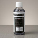Bottle of DavKitchen cleaning solution on a gray surface with a neutral background