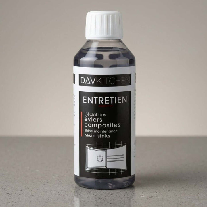 Bottle of DavKitchen cleaning solution on a gray surface with a neutral background