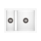 White kitchen sink with double basin on a white background